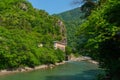 BATUMI, GEORGIA: Stone arch bridge of Queen Tamara near the Adjaristskali River on a sunny summer day. Royalty Free Stock Photo