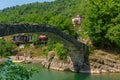 BATUMI, GEORGIA: Stone arch bridge of Queen Tamara near the Adjaristskali River on a sunny summer day. Royalty Free Stock Photo