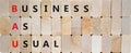 BAU business as usual symbol. Concept words BAU business as usual on wooden blocks on a beautiful wooden background. Business and Royalty Free Stock Photo