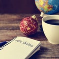 Bauble, cup of coffee, globe and text merry christmas