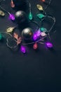 baubles and light garland, Christmas decoration on dark gray plastered background