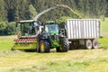 Claas Jaguar 930 harvester and a John Deere 6175R with a Fliegl Gigant trailer works on a