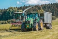 Claas Jaguar 930 harvester and a John Deere 6175R with a Fliegl Gigant trailer works on a