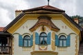 Bavarian architecture of Hohenschwangau village. Facade part of Museum of the Bavarian Kings building with the deer head with