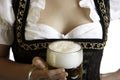 Bavarian beer girl holds Oktoberfest beer stein