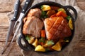 Bavarian beer roasted pork, also known as Bayerischer Schweinebraten orÃÂ Krustenbraten with vegetables close-up. horizontal top v