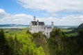 Bavarian castle Neuschwanstein in the Alps and lake Forggensee in the background (Bavaria, Germany) Royalty Free Stock Photo