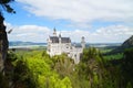 Bavarian castle Neuschwanstein in the Alps and lake Forggensee in the background (Bavaria, Germany) Royalty Free Stock Photo