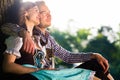 Bavarian couple in Tracht hugging