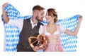 Bavarian couple in traditional costume with beer and brezel Royalty Free Stock Photo