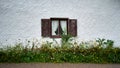 Bavarian Farmhouse Window with Traditional Lace Drapes Royalty Free Stock Photo