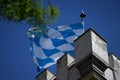 Bavarian flag flies against a blue white sky on a summer day in Bavaria Royalty Free Stock Photo