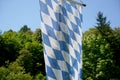 Bavarian flag flies against a blue white sky on a summer day in Bavaria Royalty Free Stock Photo