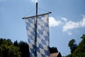 Bavarian flag flies against a blue white sky on a summer day in Bavaria Royalty Free Stock Photo