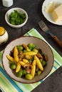 Bavarian fried finger-shaped potato dumplings with green vegetables and mushrooms