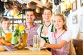Bavarian girl with family in restaurant Royalty Free Stock Photo