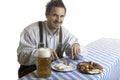 Bavarian Guy having meal at Oktoberfest Royalty Free Stock Photo