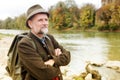 Bavarian man in his 50s standing by the river Royalty Free Stock Photo