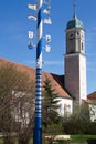 Bavarian Maypole with church Royalty Free Stock Photo