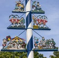 Bavarian Maypole on Viktualienmarkt, Munich, Germany. Symbols of