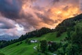 Bavarian Mountain Landscape with Meadows, Forest, Cabin and Alps during dramatic Sunset, Germany Royalty Free Stock Photo