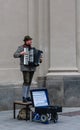 Bavarian musician play on accordion in front of town hall