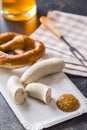 The bavarian weisswurst, pretzel and mustard. Royalty Free Stock Photo