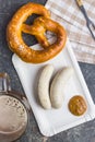 The bavarian weisswurst, pretzel and mustard. Royalty Free Stock Photo