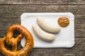 The bavarian weisswurst, pretzel and mustard. Royalty Free Stock Photo