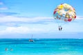 Bavaro Beach, Punta Cana, Dominican Republic - March, 2020: Tourists parasailing on Bavaro Beach in Dominican Republic