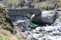 Bavona Valley, Switzerland, 12. April 2022: Old romain stone bridge over the Bavona River in Ticino, Switzerland.
