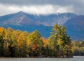 Baxter Peak view surrounded by moody clouds from Lake Katahdin, Maine, in early fall Royalty Free Stock Photo