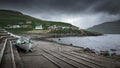 Bay with boat and colorful houses in the village of ElduviÂ­k on Eysturoy, Faroe Islands