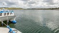 Bay on Inishbofin Island with boats and a ship docked in the harbor