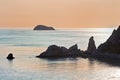 Bay with irregularly shaped rocks at sunset. Royalty Free Stock Photo