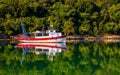 Bay of Lim, Istria, Croatia. Fishing boat catching oysters farm.