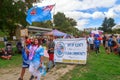 Fijian people marching with flag at multicultural festival