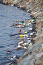 The bay polluted with trash and plastic