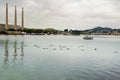 Bay of Water, Boats, and Silhouettes of Sleeping Sea Otters