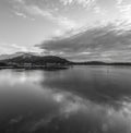 Bay waterscape with reflections in monochrome Royalty Free Stock Photo