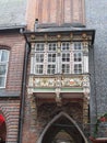 A bay window with angels on the facade of a historical baroque house in the Hanseatic city of LÃ¼beck Germany