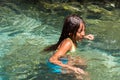 BAYAHIBE, DOMINICAN REPUBLIC - MAY 21, 2017: Girl bathes in a natural lake. Close-up.