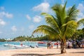 BAYAHIBE, DOMINICAN REPUBLIC - MAY 21, 2017: Tourists near boats. caribbean landscape. Copy space for text.