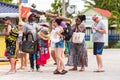 BAYAHIBE, DOMINICAN REPUBLIC - MAY 21, 2017: Tourists and the seller of souvenirs in the street.