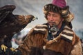 Bayan-Olgii, Mongolia - October 01, 2017: Festival Of Hunters With Golden Eagles. Portrait Of Unfamiliar Mongolian Hunter With Ber