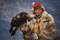 Bayan-Olgii, Mongolia - October 01, 2017: Golden Eagle Festifal.Old Picturesque Mongolian Hunter In Traditional Clothes Of Fox Fur