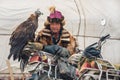 BAYAN-OLGII PROVINCE, MONGOLIA - OCT. 01, 2017: Traditional Mongolian Golden Eagle Festival. Unknown Mongolians Hunter Berkutch