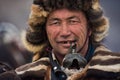 BAYAN-ULGII, MONGOLIA - OCTOBER 01, 2017: Golden Eagle Festival. Portrait Of Unknown Mongolian Hunter With Expressive Sight And Ru