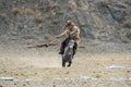 BAYAN-ULGII, MONGOLIA - OCTOBER 01, 2017: Traditional Golden Eagle Festival. The Flying Golden Eagle And Unknown Mongolian Hunter Royalty Free Stock Photo