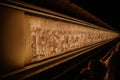 BAYEUX, FRANCE - AUGUST 25, 2022 Detail of the Bayeux Tapestry depicting the Norman invasion of England in the 11th